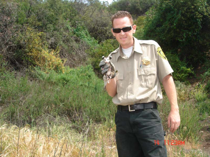 Jeremy Bailey holding opossum